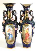 PAIR OF CONTINENTAL LATE 19th CENTURY LARGE PORCELAIN TWO HANDLED VASES, with trumpet topped long