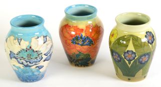 THREE DENNIS CHINA WORKS porcelain ovular VASES with tube lined matte colour floral decoration 5 1/