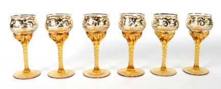 SET OF SIX VENETIAN AMBER AND GILT GLASS LIQUEUR GLASSES, on tall spirally twisted stems, 4in (10.