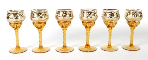 SET OF SIX VENETIAN AMBER AND GILT GLASS LIQUEUR GLASSES, on tall spirally twisted stems, 4in (10.