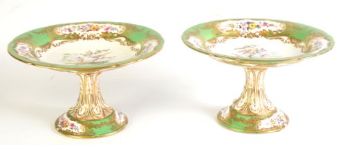 19th CENTURY COALPORT CHINA PAIR OF PEDESTAL DESSERT DISHES, the bowls painted with exotic birds