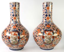 PAIR OF JAPANESE MEIJI PERIOD HIZEN PORCELAIN BOTTLE-SHAPE VASES, decorated in IMARI palette and