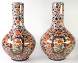 PAIR OF JAPANESE MEIJI PERIOD HIZEN PORCELAIN BOTTLE-SHAPE VASES, decorated in IMARI palette and