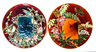TWO VERY SIMILAR CIRCA 1900 VILLEROY & BOCH (METTLACH) POTTERY WALL PLAQUES, colourfully glazed