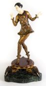 BRONZE AND IVORINE ART DECO STYLE FIGURE OF A WOMAN DANCING with both hands at shoulder height,
