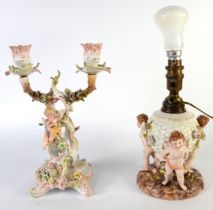 SITZENDORF, GERMAN, PORCELAIN TABLE LAMP in the form of a spherical basked supported by three winged