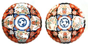 PAIR OF ORIENTAL IMARI PORCELAIN CIRCULAR PLAQUES, with fluted borders and scolloped edges,