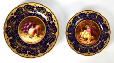 TWO COALPORT CHINA CABINET PLATES, painted with fruit against a natural background, each signed FH
