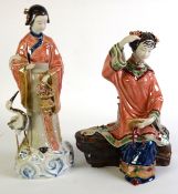 MODERN ORIENTAL GLAZED PORCELAIN SEATED FEMALE FIGURE, with bisque face and hands, the hand