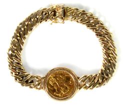 9ct GOLD CHAIN BRACELET with flattened curb pattern links and centre by a Victorian 1894 GOLD HALF
