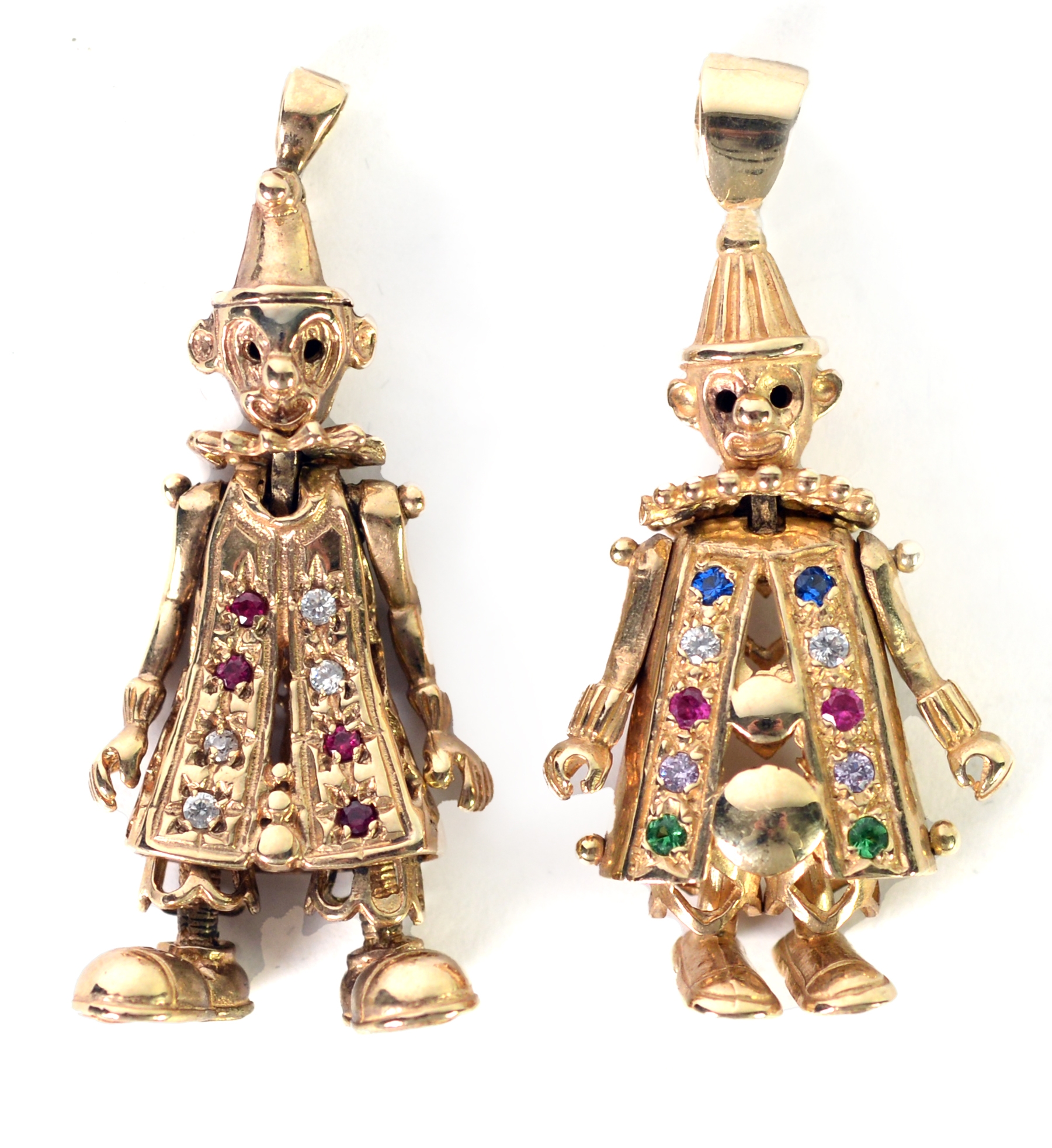 TWO 9ct GOLD ARTICULATED FIGURES of clowns, as pendants, paste set, 1 ½” (3.5cm) high, excluding the