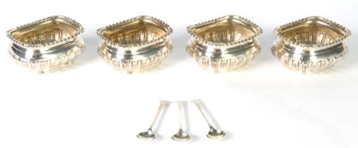 SET OF FOUR EDWARDIAN SILVER SALT RECEIVERS, of Georgian style, bulbous oblong and semi-lobed, the