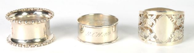 EDWARDIAN SILVER NAPKIN RING, D shaped and cut card pierced with roses, Birmingham 1905; '