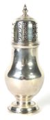 SILVER PEAR SHAPED SUGAR CASTOR, the pierced high domed cover having an urn finial, on short stem