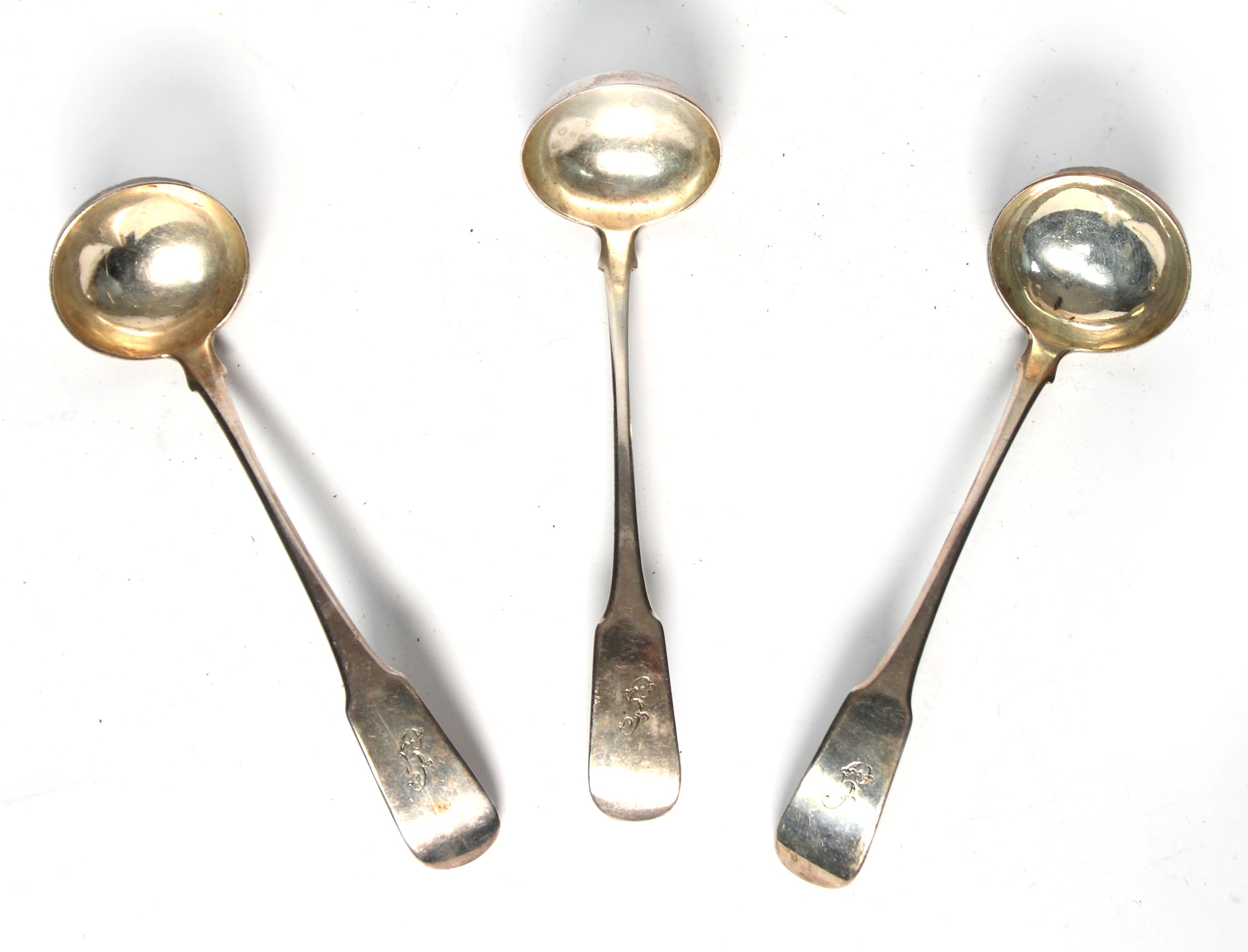 SET OF THREE GEORGE III SILVER SAUCE LADLES, fiddle handled, initialled G, maker's mark '1 J.Mc.',