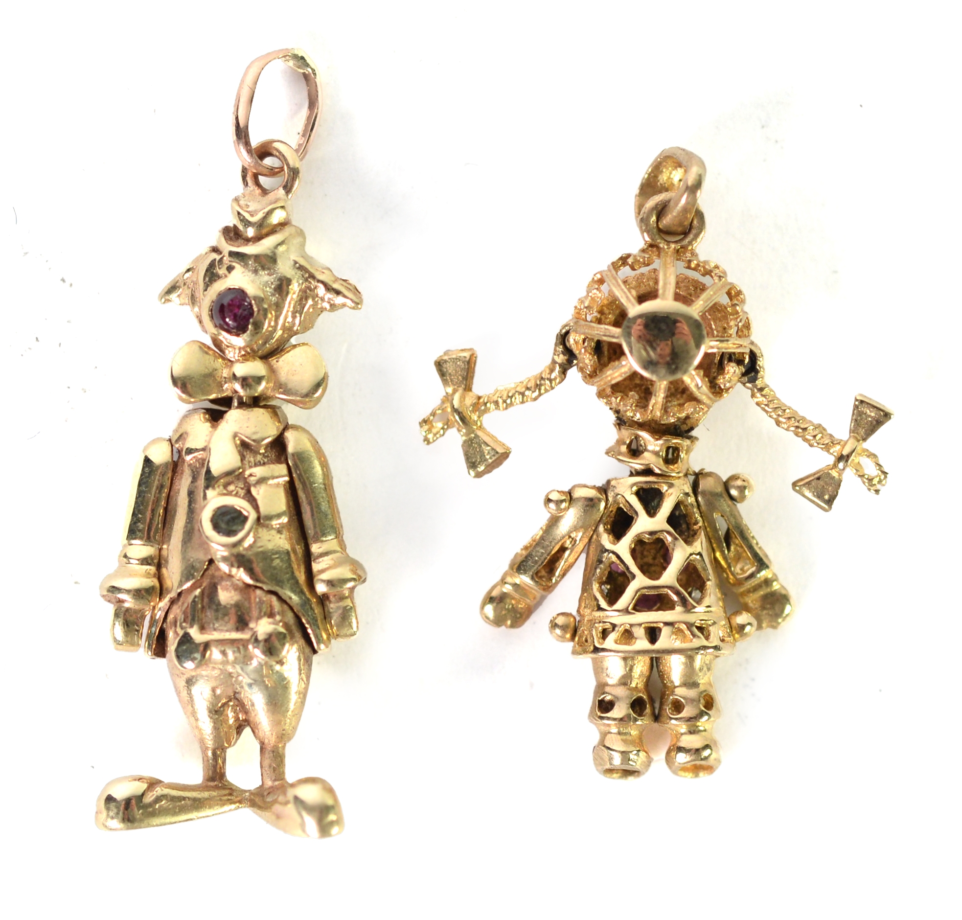 TWO 9ct GOLD ARTICULATED FIGURES of a clown and a girl with plaits, as pendants, paste set,