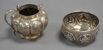 TWO PIECES OF UNMARKED INDIAN EMBOSSED SILVER COLOURED METAL, comprising: MILK JUG, with cobra