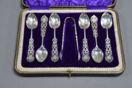 CASED SET OF SIX EDWARD VII SILVER TEASPOONS AND PAIR OF SUGAR TONGS BY COOPER BROTHERS & SONS, with