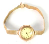 LADY'S BUREN WRISTWATCH in 9ct GOLD CASE, circular roman dial and the 9ct GOLD MESH BRACELET, 25.