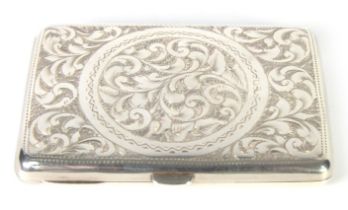 LATE VICTORIAN SILVER NOTE CASE, oblong and floral and foliate scroll engraved, with light tan