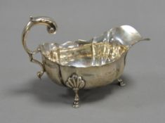 EDWARD VII SILVER SAUCE BOAT BY GEORGE NATHAN & RIDLEY HAYES, with acanthus capped flying scroll