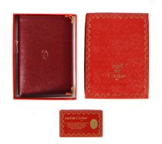 MUST DE CARTIER burgundy leather wallet with zip fastening coin section 6"x4"(15x10cm) in associated