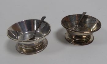 PAIR OF SILVER CIRCULAR SALT RECEIVERS, with sloping straight sides, on cushion knop and circular