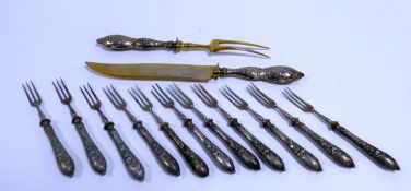 PART SET OF ELEVEN CONTINENTAL SILVER (800 STANDARD) DESSERT KNIVES WITH FILLED HANDLES, together