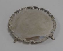 GEORGE V SILVER WAITER BY EDWARD BARNARD & SONS, with plain centre, moulded border and pointed feet,