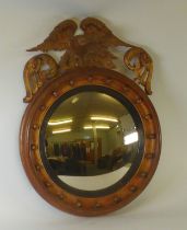 NINETEENTH CENTURY CIRCULAR CONVEX MIRROR with carved giltwood Ho-Ho bird cresting piece and