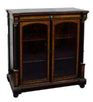 VICTORIAN AESTHETICS EBONIESE AND AMBOYNA DOUBLE-FRONT PIER CABINET, with flanking Ionic columns and