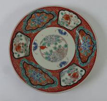 ORIENTAL PORECLAIN PLAQUE THE CENTRE ENAMELLED with three bats and foliage, the broad border with