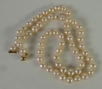 SINGLE STRAND NECKLACE OF UNIFORM CULTURED PEARLS, with 14ct gold spherical clasp, 18in (45.7cm)