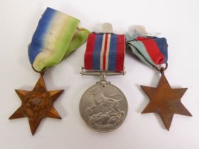 THREE WORLD WAR II SERVICE MEDALS, comprising an Atlantic Star, a 1939-1945 Star and a 1939-1945 War