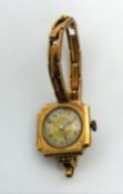LADY'S SWISS 9ct GOLD WRISTWATCH, with 15 jewels movement, circular arabic dial, square case wiht