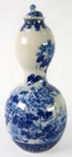 JAPANESE MEIJI PERIOD HIZEN PORCELAIN DOUBLE GOURD-SHAPE VASE with small cover, painted in