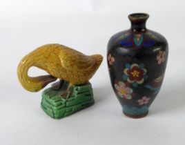 SMALL ORIENTAL CLOISONNE OVULAR VASE decorated with two butterflies and flowers on a black