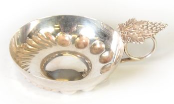 SILVER TASTEVIN WINE TASTING CUP, with shallow circular bowl, ring handle with fruiting vine