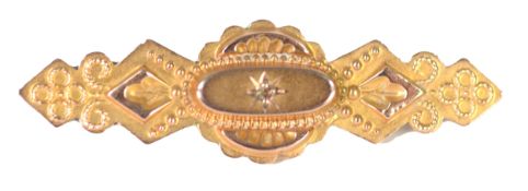 EARLY 20th CENTURY 9ct GOLD WING SHAPED BROOCH, star set with a tiny diamond, applied filigree