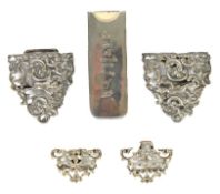 VICTORIAN SILVER CAST AND PIERCED OVAL TWO PART BUCKLE, ROSES SCROLL pattern each with a naked putti