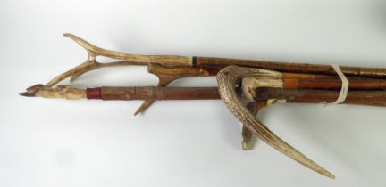 WALKING STICKS: a collection of antler handled thumb sticks, walking sticks and one with a deer slot
