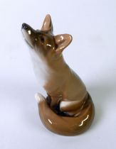 ROYAL COPENHAGEN CHINA model of a seated fox smelling the air, 5 3/4" high (14.5cn) No 946/1475
