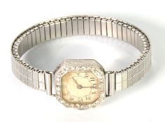 LADY'S PLATINUM AND DIAMOND WRISTWATCH, with mechanical movement, with small silvered arabic dial,