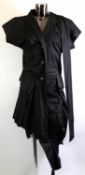 VIVIENNE WESTWOOD: Black cotton alphabet skirt suit with wrap around shirt jacket; plus black cotton