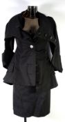 VIVIENNE WESTWOOD GOLD LABEL: Black cotton viscose skirt suit with corseted jacket with long lapels,