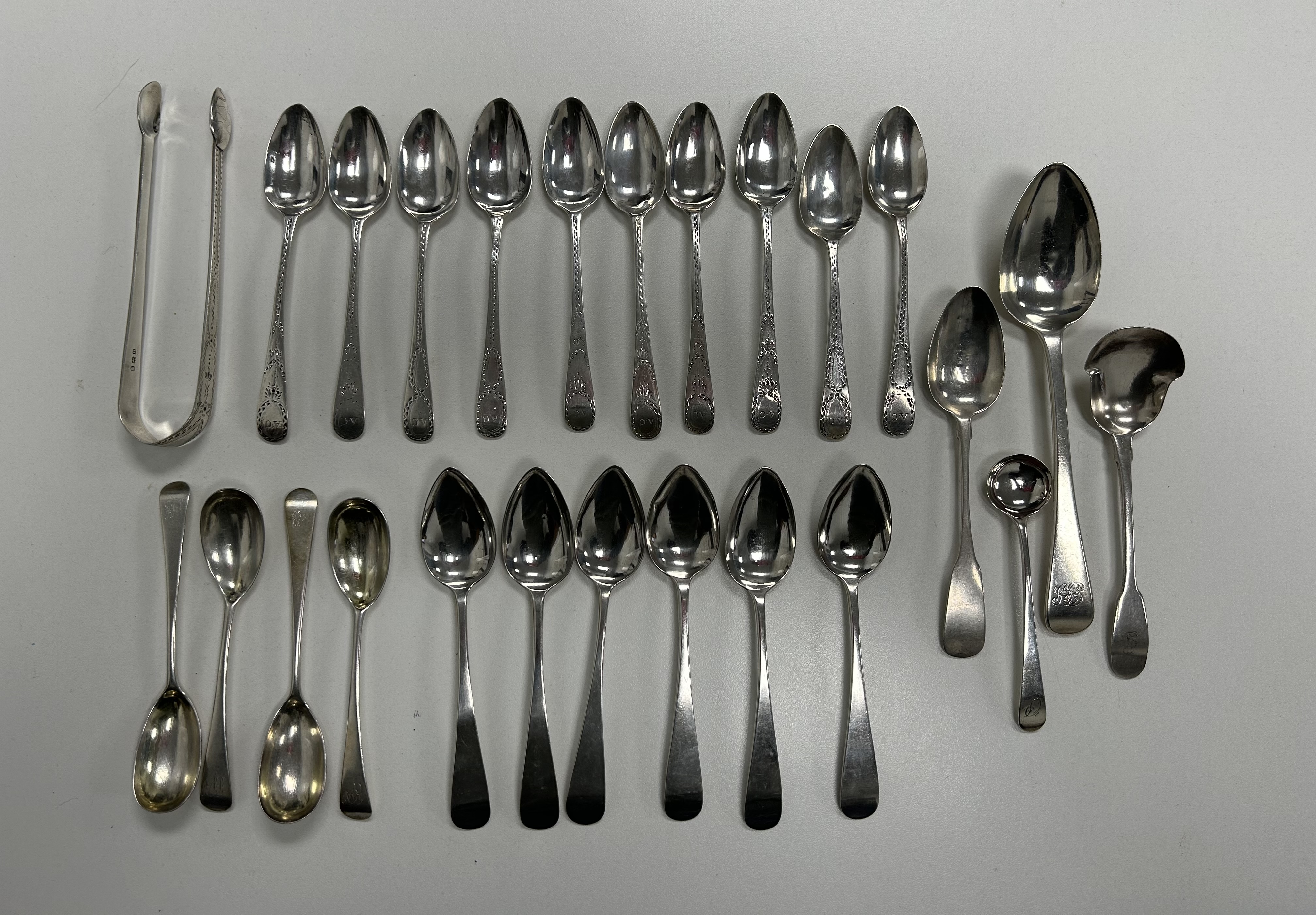 Two sets of George III provincial Old English pattern teaspoons and other silver