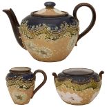 A Doulton Lambeth Slaters Patent stoneware three piece tea service