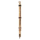An Edwardian gold and enamel combination pen and two colour propelling pencil