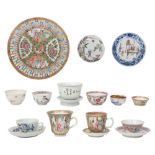 A Chinese porcelain tea bowl on stand, and other tea bowls and saucers