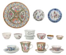 A Chinese porcelain tea bowl on stand, and other tea bowls and saucers